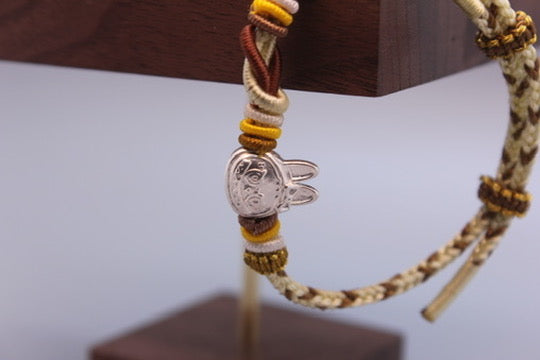 Artisan Woven Bracelet with Silver Sculpted Head Charm