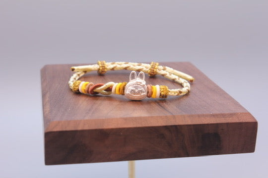 Artisan Woven Bracelet with Silver Sculpted Head Charm