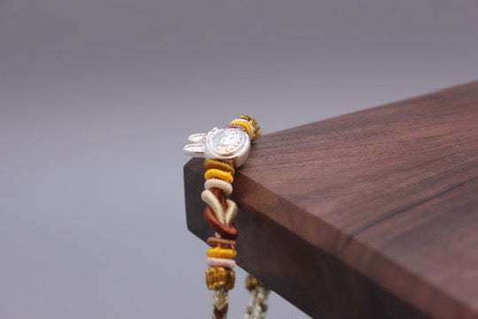 Artisan Woven Bracelet with Silver Sculpted Head Charm