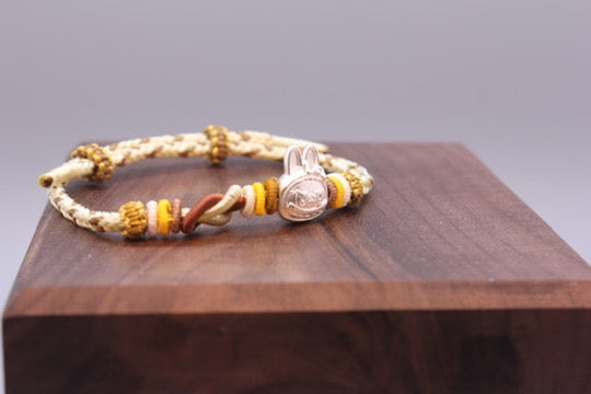 Artisan Woven Bracelet with Silver Sculpted Head Charm